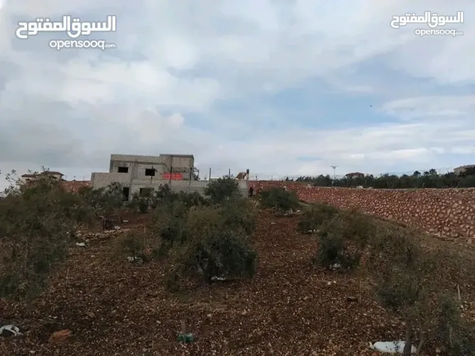 قطعة ارض مع بيت للبيع