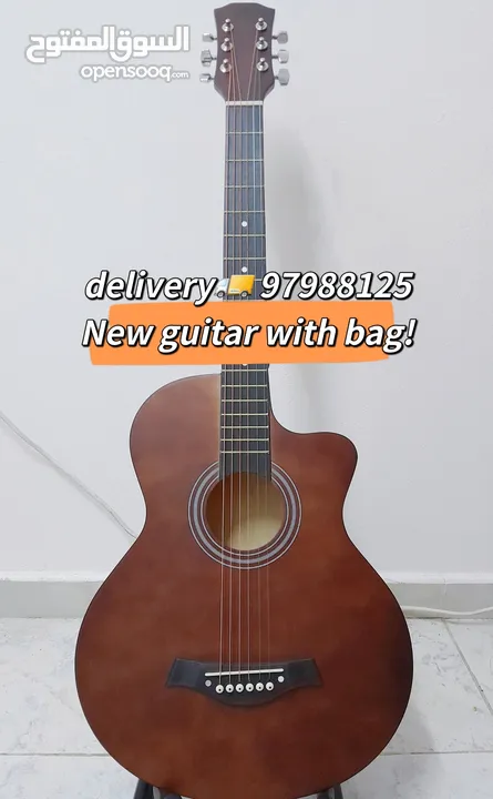 New acoustic guitar, with bag and picks, delivery