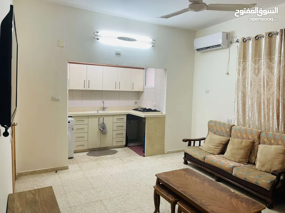 شقة مفروشة للإيجار Ground floor apartment with a front garden for rent on Al-Mala'ab Street in Qalqi