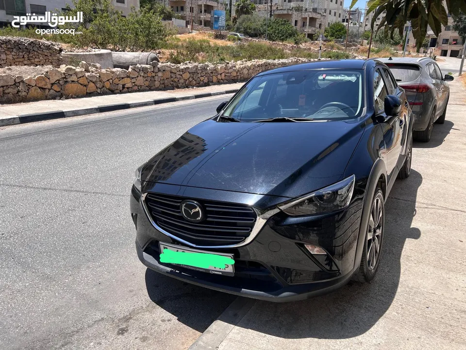 سيارة مازدا موديل 2023 اصل صفر كيلو ماشية 20 الف لون اسود ، بسعر 100000 شيقل نص كاش ونص شيكات.