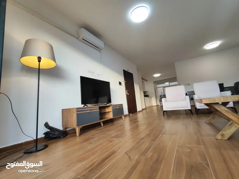 شقة جديدة مفروشة مع حديقة للإيجار – عين منجد  شارع إسكان المهندسين