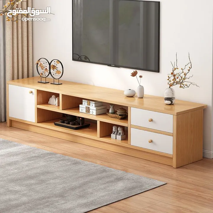 طاولة تلفزيون بلون أبيض وخشبي بتخطف الأنظار! المقاس 160*30*40 سم تصميم مودرن وعصري