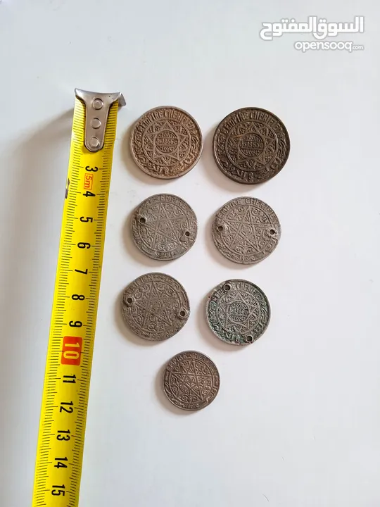 مجموعة قطع نقدية قديمة للفرنك المغربي(1366المملكة الشريفة) عمرها 80 سنة.