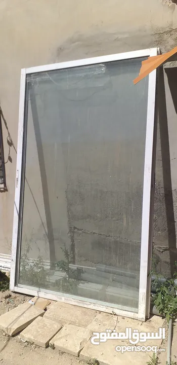 باب واجه باب محل المنيوم سحاب لون حليبي مقاس 2،80م ×2،30م
