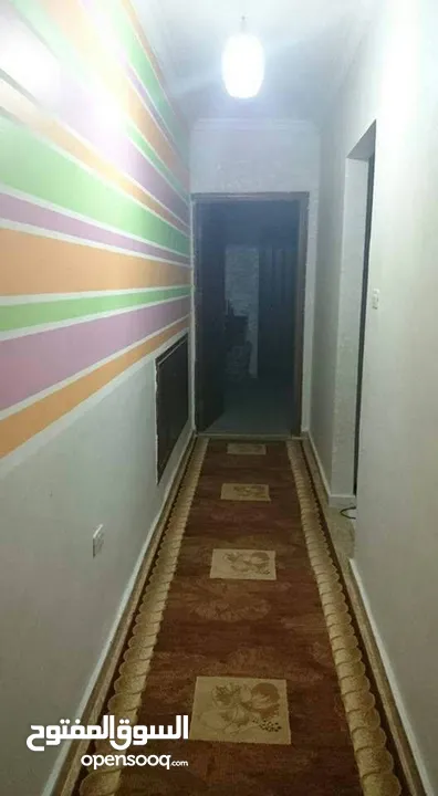 شقة أرضي وسط مع موقف تحت البناية