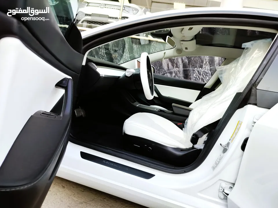 تيسلا 2021 model 3 فحص كامل 4 جـيـد فرش ابيض جنط 19بحالة الوكالة لون مميز للبيع بسعر لقطة ومحروووق
