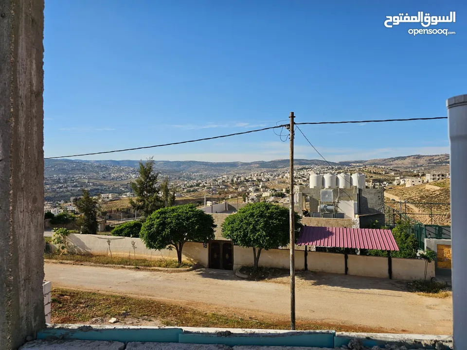 قطعة ارض مع بيت للبيع