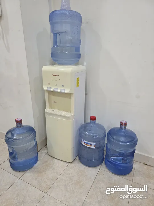 Water dispenser with 4 Almanhal/Nestle water bottles-30 BD
