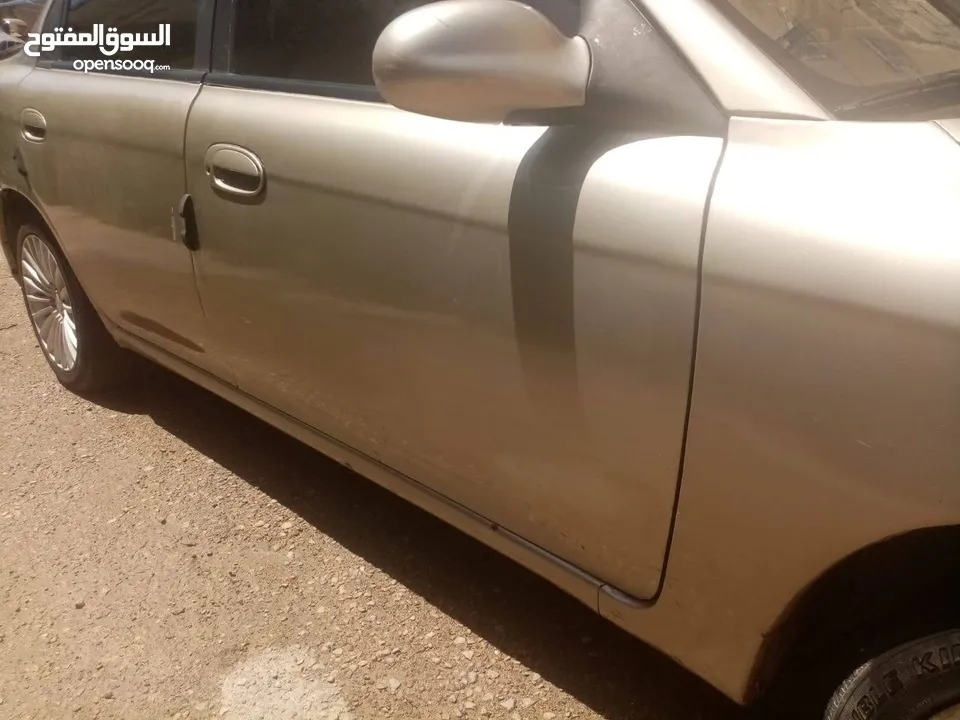 كيا 2 قير عادي مرخصه سنه للبدل على سياره  اتماتيك