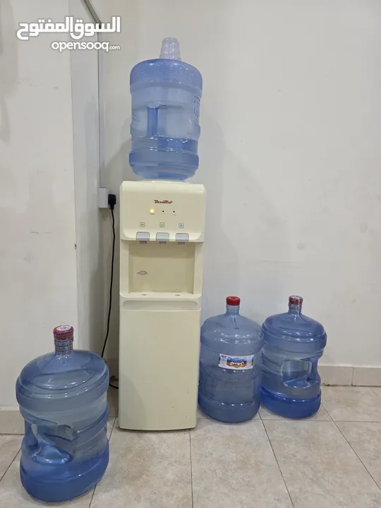 Water dispenser with 4 Almanhal/Nestle water bottles-30 BD