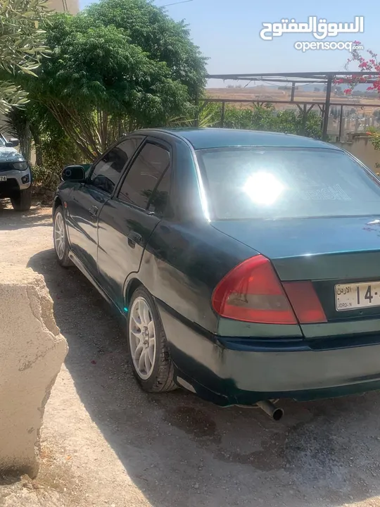 متسوبيشي لانسر 1997 موجوده في جرش في مجال للتفاوض بشي بسيط