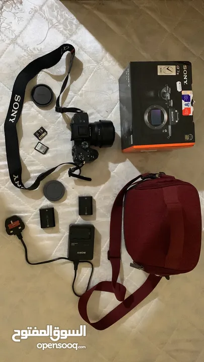sony A73 camera body +50mm1.8 + charger + 2battery + 2 sd cards + red clr bag