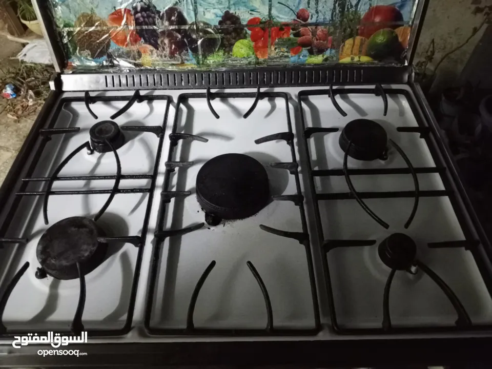 بوتغاز يونيرفسال ابيض شغاله فوق تحت وبسعر حرق.....
