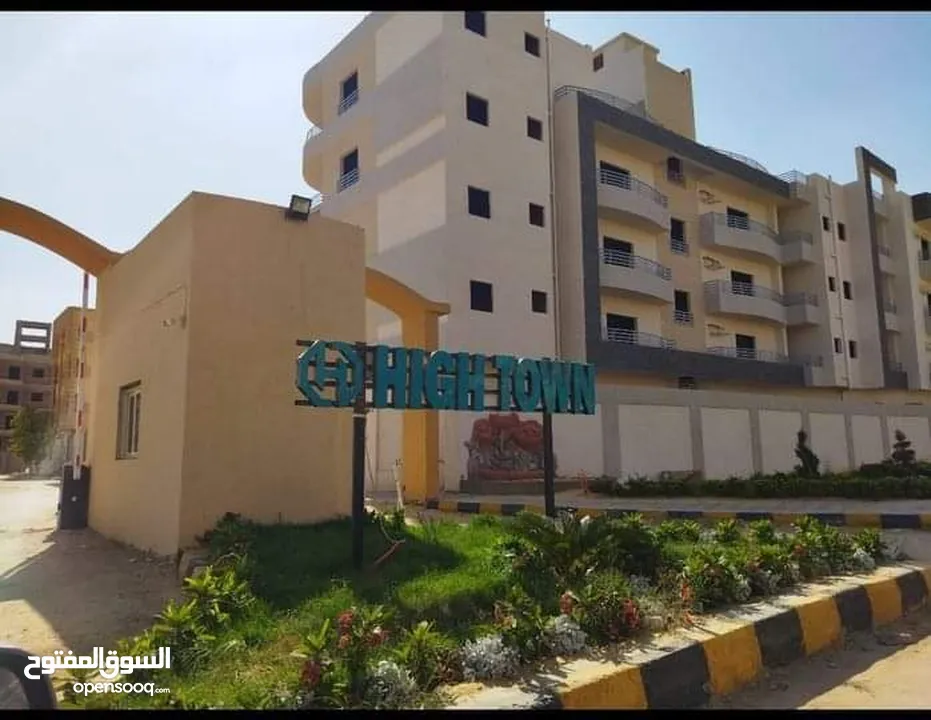 Apartment for sale in High Town Compound, directly on Gamal Abdel Nasser Axis, behind Mall of Arabia