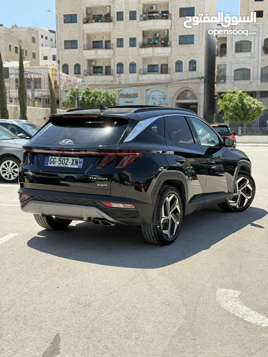 هونداي توسان ترخيص 2022 محرك 1600 هايبرد plug in/يقطع على الشحنه 65 كيلو متر
