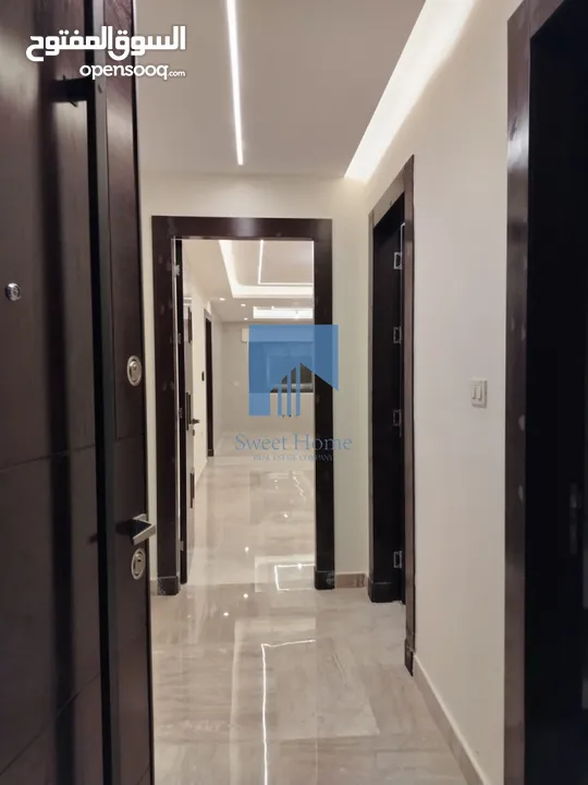 شقة أرضية فاخرة للبيع في خلدا - قرب إشارة الدر المنثور 140م مع حديقة وترسات 70م لم تسكن
