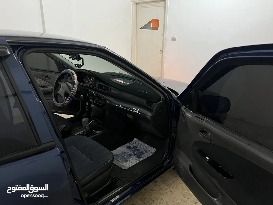 كيا سيفيا لون ازرق ميتالك نظيفه مع جنط 15 مميز كاوشوك وكاله غرفه نطيفه بطاريه جديده لسى كفالتها معها