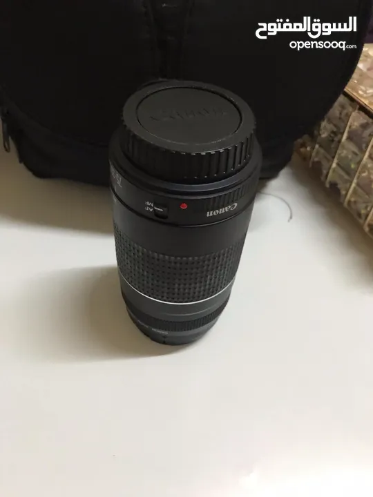 عدسة Canon  75-300 بحالة الوكالة مع الغطاء الأمامي والغطاء الخلفي