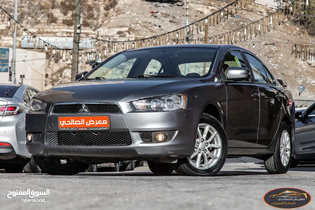 Mitsubishi Lancer Gls 2016    السيارة بحالة الوكالة و قطعت مسافة 112,000 كم فقط