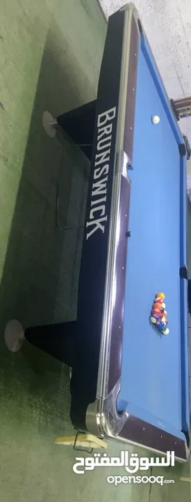 طاولة بلياردو امريكي برونزيك شبه جديدة بسعر حرق حرق 6000.