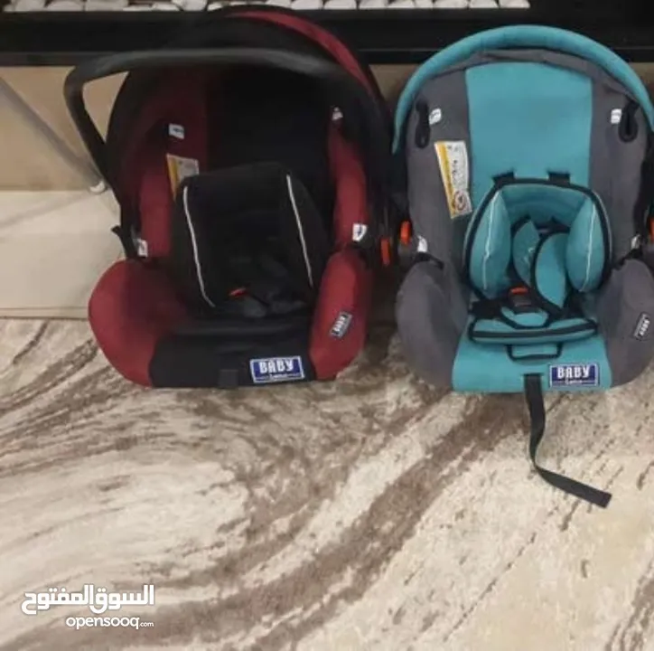 كارسيت بيبي - مقعد سيارة بيبي نوع  Baby Leno  لغاية عمر 6 أشهر- (عدد 2) لون أحمر و فيروزي