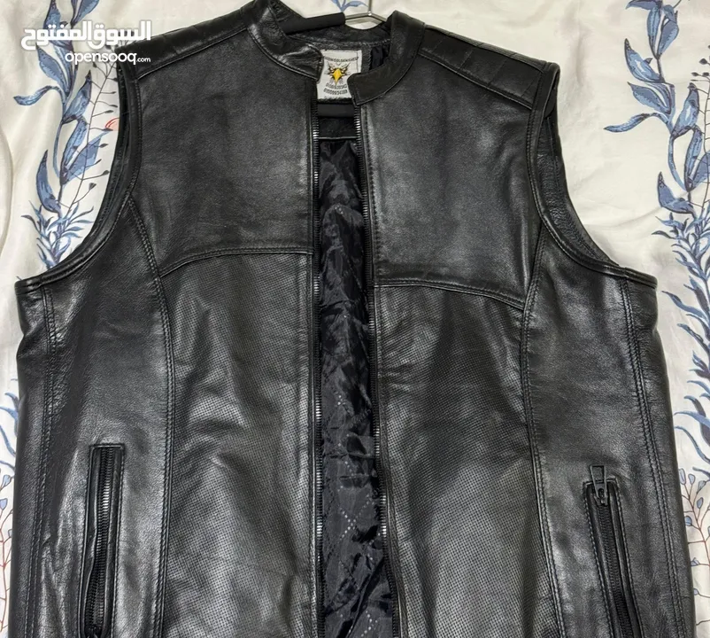 Original leather Biker’s vest and various helmets