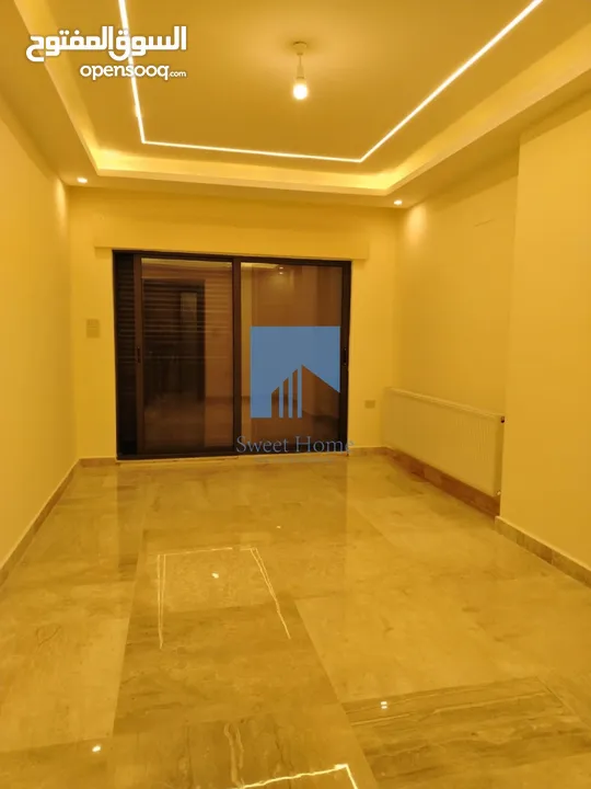 شقة أرضية فاخرة للبيع في خلدا - قرب إشارة الدر المنثور 140م مع حديقة وترسات 70م لم تسكن
