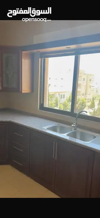 Excellent natural light and winds with views of Shafa Badran from the highest level in the building.