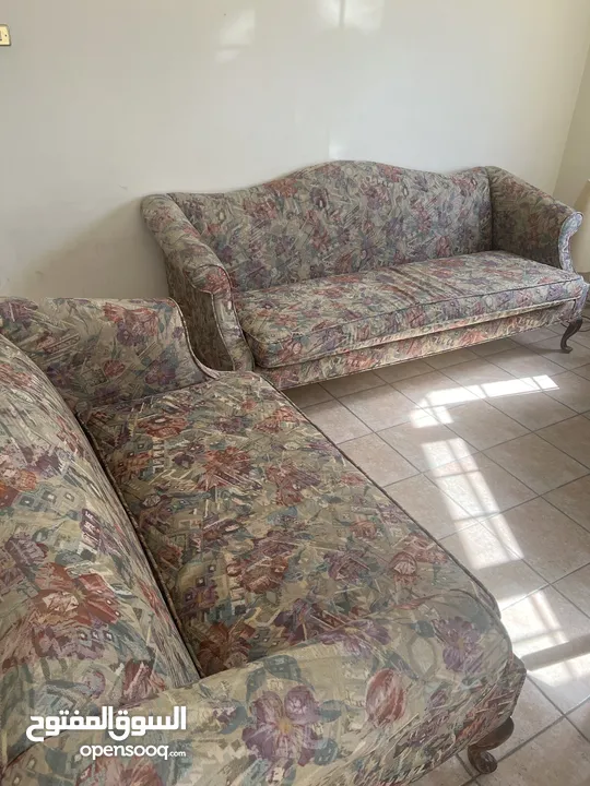 Sofa set that includes two couches and one round sitting sofa