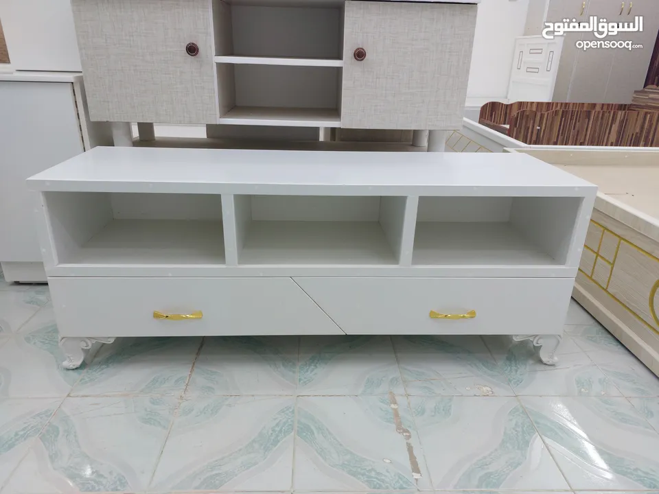 Tv Cabinet with Shaped Sliding Drawers and Golden paint At lowest price, From 48 Riyal to Only 35