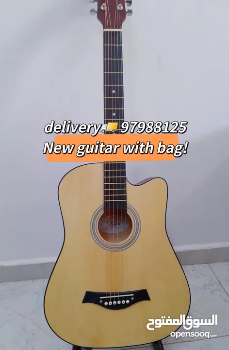 New acoustic guitar, with bag and picks, delivery