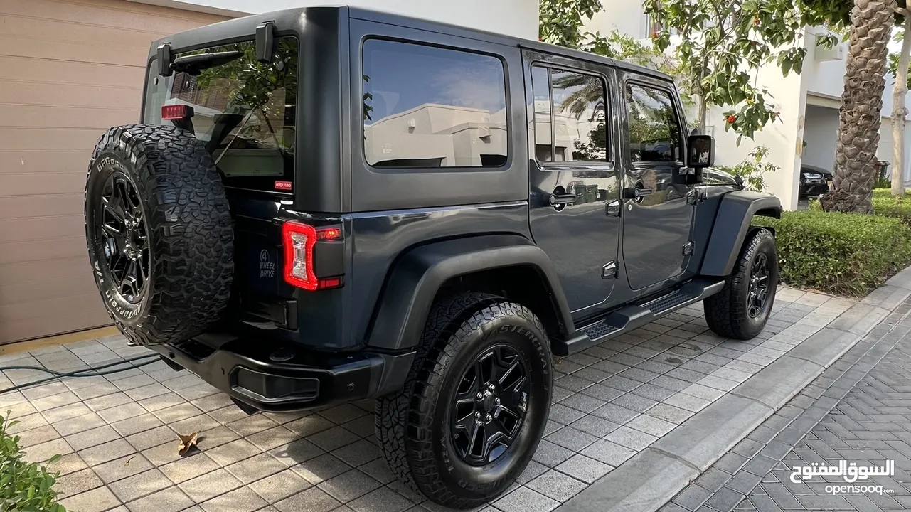 Jeep Wrangler JK Willys, 2017, GCC Spec, 4 Door, 82,800 Kms, Dark Grey, 9200 RO. See in Al Mouj.