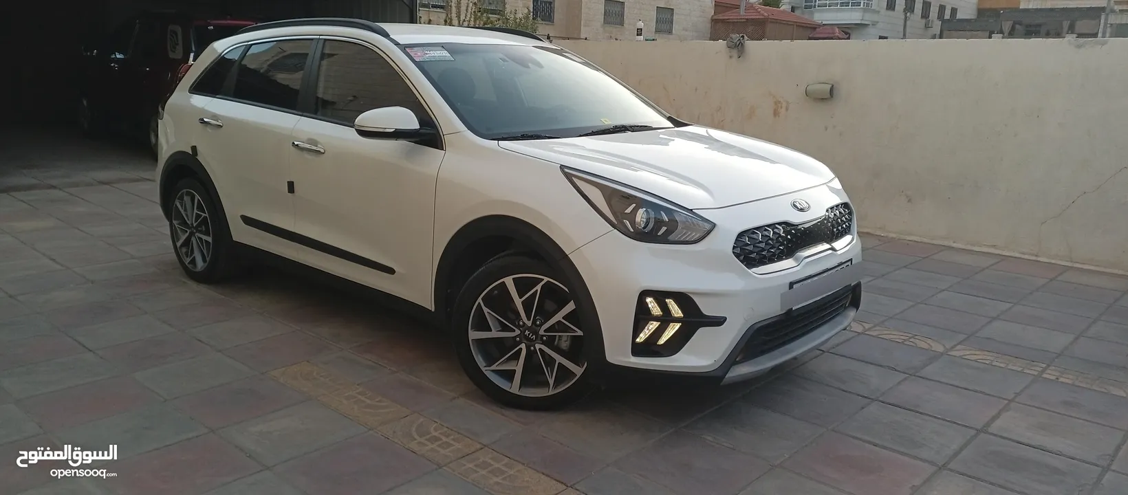 كيا نيرو 2021 جمرك جديد وارد كوري ممشي 32  الف فحص كامل جنطات تورنج