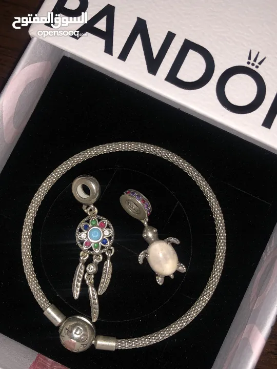 PANDORA bracelet, for sale, plus two charms as a gift. price for all 60 dinars