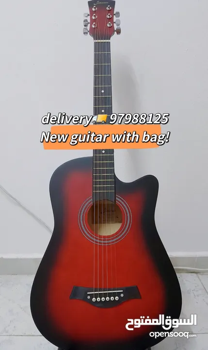 New acoustic guitar, with bag and picks, delivery