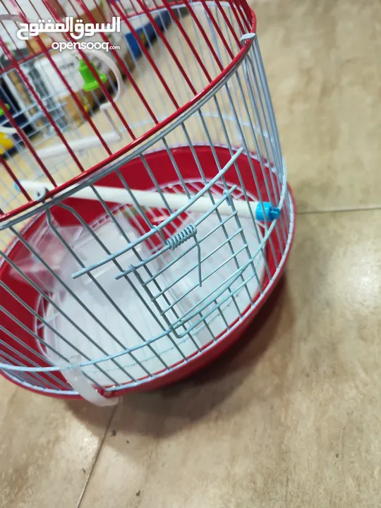 قفص الطيور الدائري الأحمر المميز  مناسب لطيور الحب والروز و الفيشر و الجنة