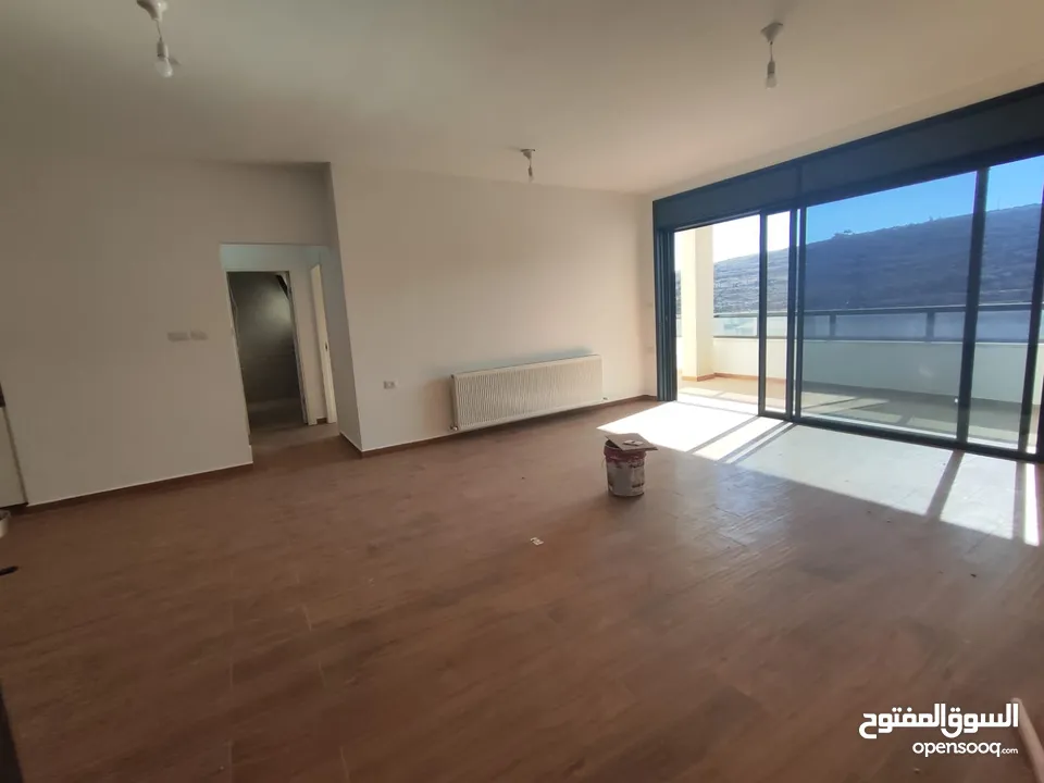 شقة قيد الفرش للإيجار – عين منجد / شارع إسكان المهندسين