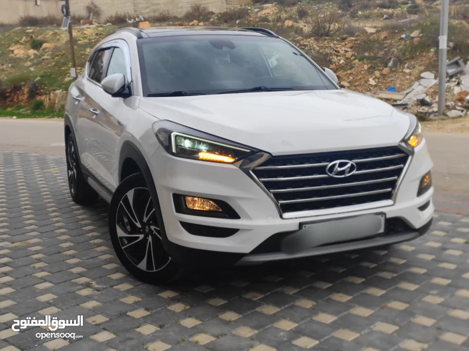 هونداي توسان فل الفل اضافات دهان شركة وعداد أصلي 70000كم فقططط رخصة وتأمين شامل للبيع بسعر مغري