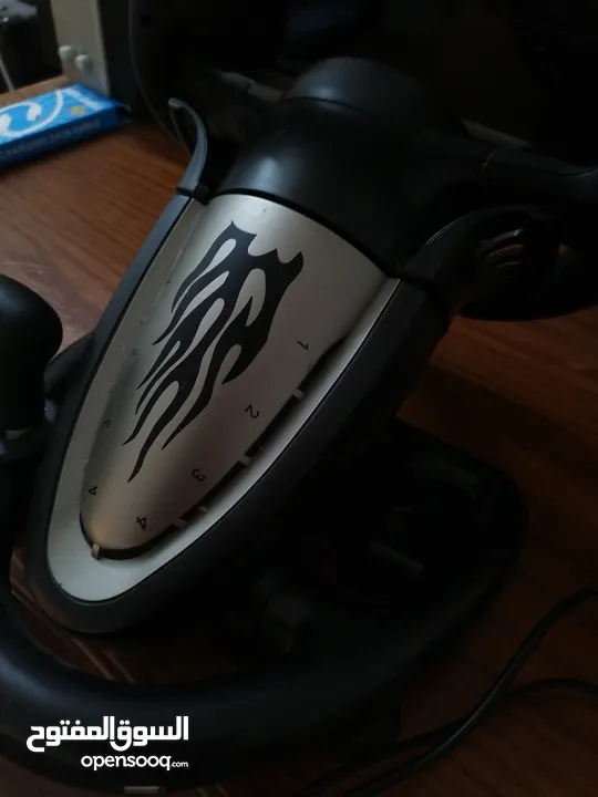 a pxn simulator pack with a steering wheel and a pedals with a gear shifter