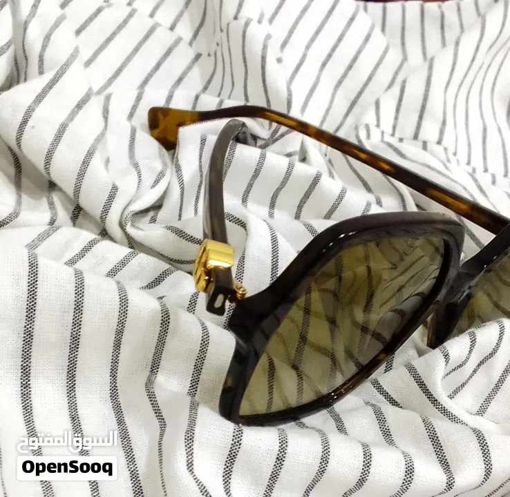 نظارات شمسية Gucci havana اصلية 100% شبه جديدة مع الرقم التسلسلي موجود فيها