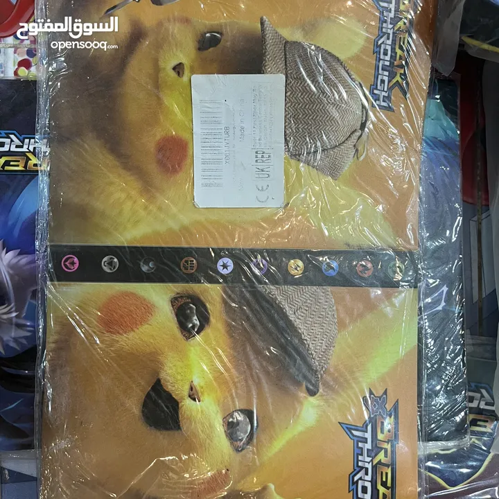 كروت بوكيمون والبومات (Pokemon cards and binders)