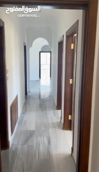 Excellent natural light and winds with views of Shafa Badran from the highest level in the building.