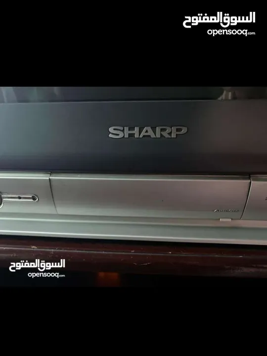 تلفزيون sharp وطاولة تلفاز خشب قااااااابل للتفاوض