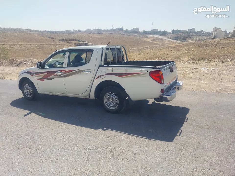 ميتسوبيشي L200 موديل 2015 واطي بنزين بحاله الشركه