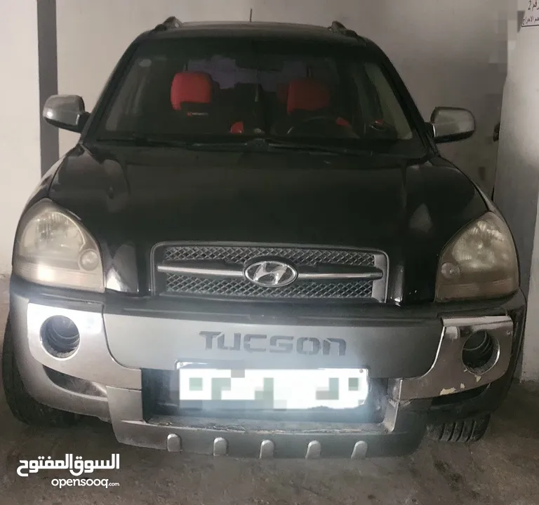 توسان  لون أسود 2006  بحاله ممتازة