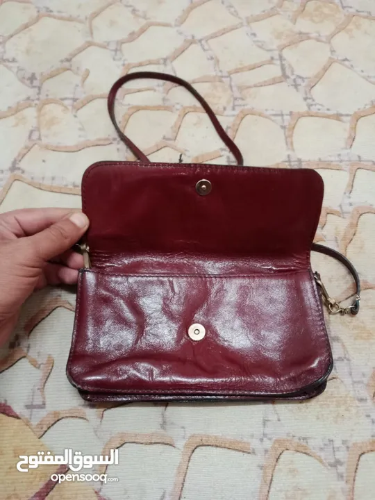 شنطة وحقيبة جلدية فاخرة وانيقة للسيدات بلون خمري أنيق مصنوعة من الجلد الأصلي الطبيعي 100 %
