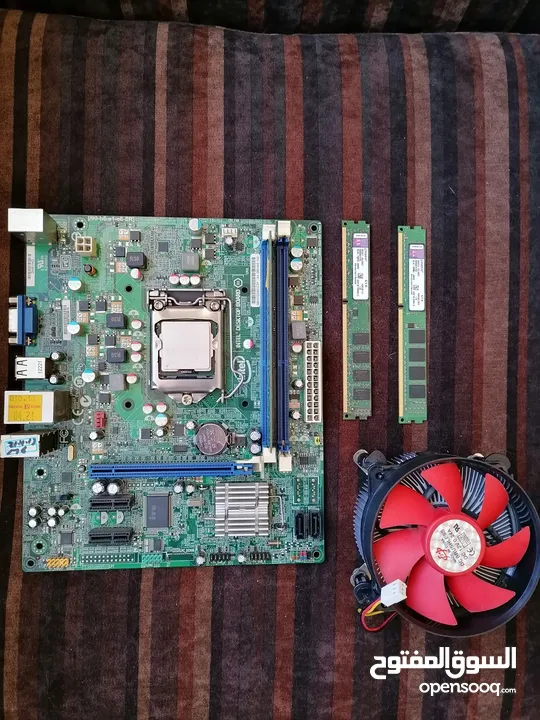 مذر بورد intel مع معالج core i3 -2130 مع مروحه تبريد مع 5 رامات Kingston كل وحده 4 جيجا ...