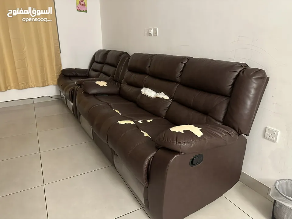 Recliner type sofa, damaged repairable.