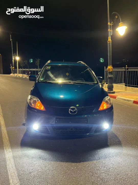 مازدا 5 جير عادي 6+1 متور 2000 بنزين رخصه و تامين جديد  عداد قليل فحص نخبب سعرر كااششش