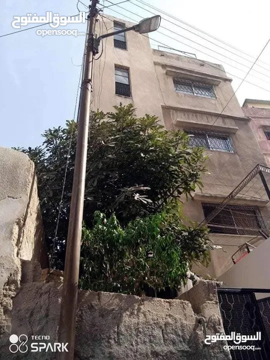 عمارة وارض للبيع